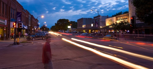 Cars moving fast at night at downtown Vermillion.