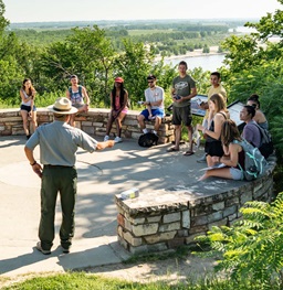 Park Ranger Speaking to a Group of Students by the Missouri River