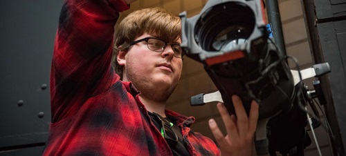 Student uses video production equipment.