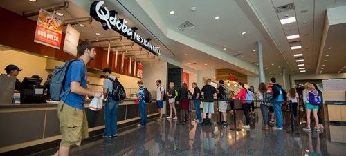 Students waiting in line to eat at Qdoba Mexican Grill