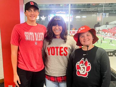Addie and her two sons wearing Coyote gear. 