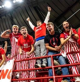 Students cheering at a USD Football game