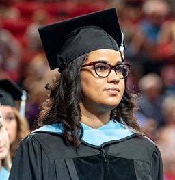 Graduate Student at Graduation Ceremony.