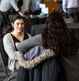 Female Speaking to Potential Employer at Networking Event.