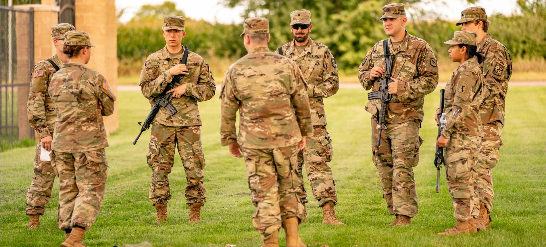 Group of ROTC Cadets Talking in a Circle.