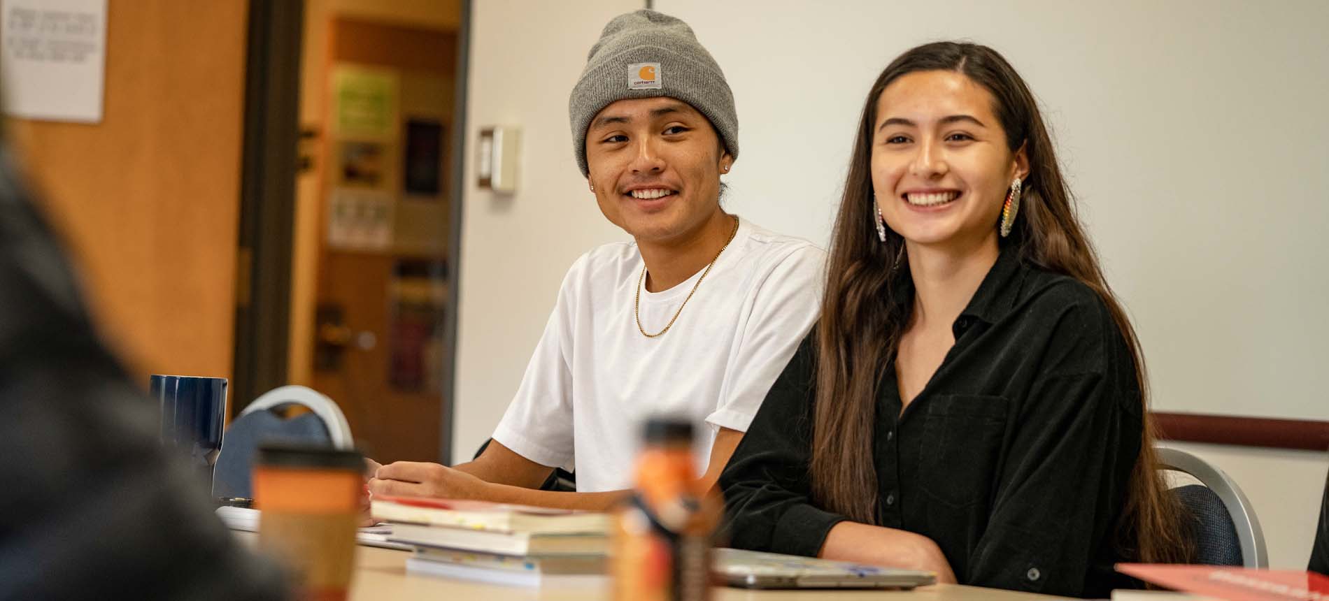 Two Native American Students Smiling.