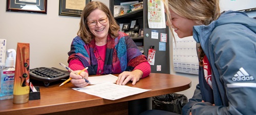 Academic Advisor Helping Student with Registration.