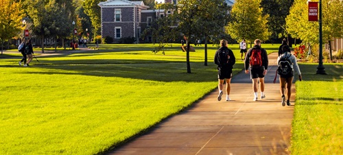 Students Walking Outdoors.