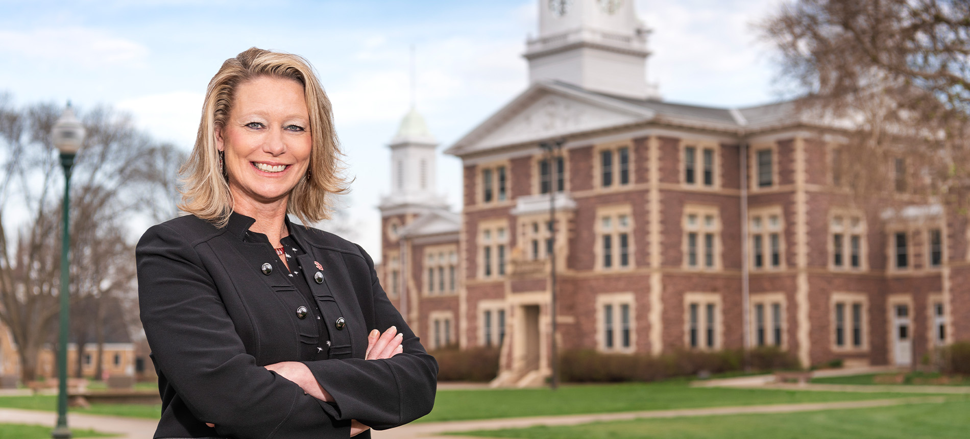 President Gestring standing outside of Old Main