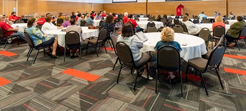 Faculty and Staff Listening to Presentation.