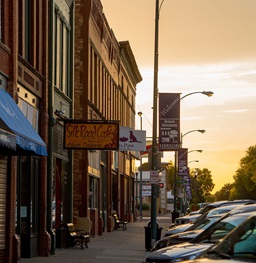 A sidewalk and sign on downtown Vermillion.