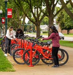 Students using the USD bike share program.