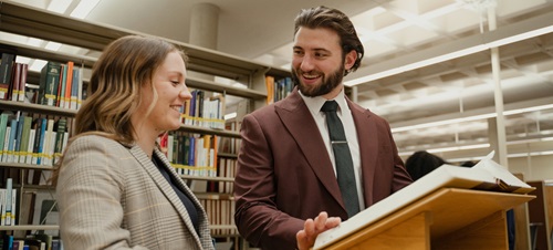 Two law students studying in the McKusick law library.