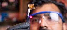 Chemist Student Examining a Piece of Material