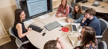 Instructor students discussion table video screen