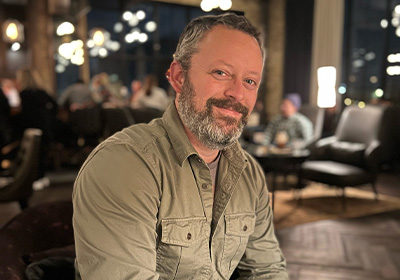 Author Benjamin Percy smiling.