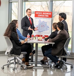 Young Professionals Sitting Around a Table