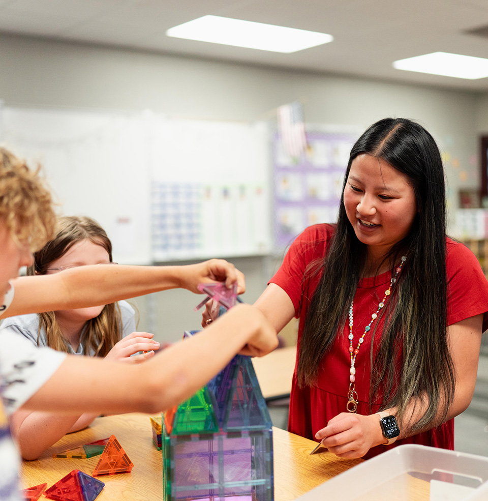 Student teacher working with students.