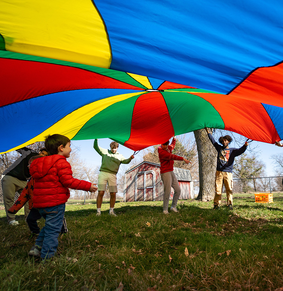 Playing under parachute.