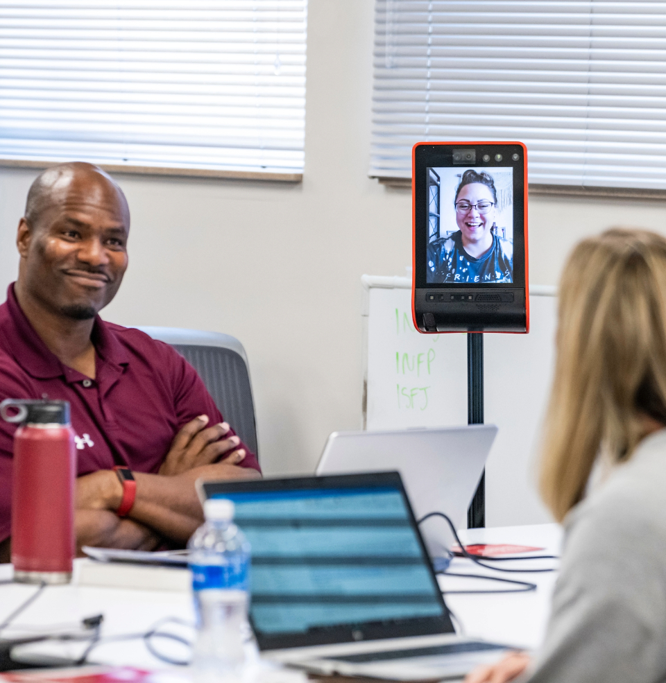 An educational leadership student attending a hybrid class.