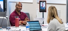 Students in a zoom meeting talking.