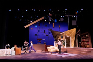 Theatre production on stage decorated as inside a room