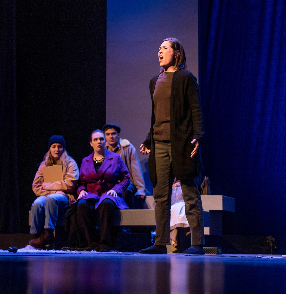A USD student performing opera on stage.
