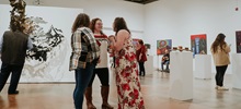 Students and visitors admiring art in the University Art Galleries.