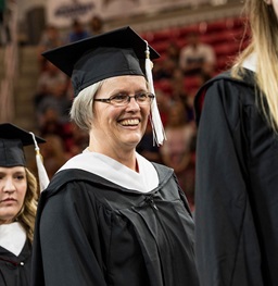 Graduate student at commencement.