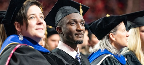 Graduate students in full regalia at the graduation ceremony