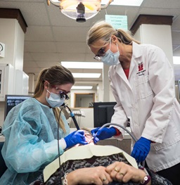 Dental Hygiene Student and Faculty Member Working in Clinic
