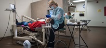 Dental Hygiene Student Cleaning a Patient's Teeth