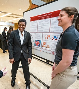 Health sciences students delivering research presentations.