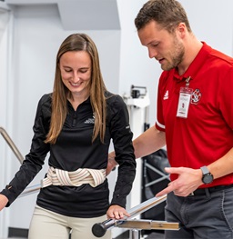 A person working with a USD student physical therapist.