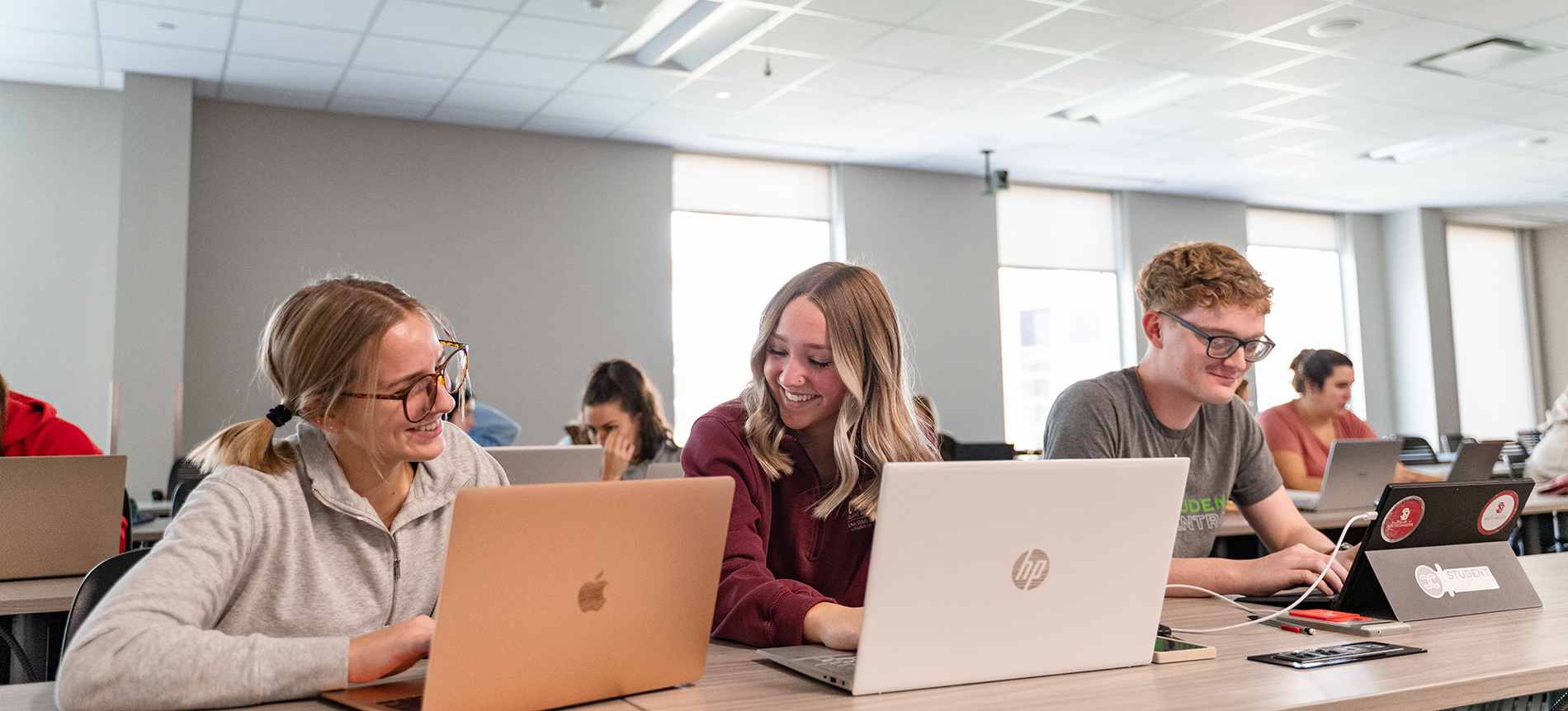Students working on their computers in a classroom