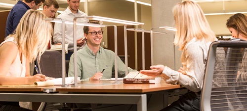  Law Students Studying Around a Table.