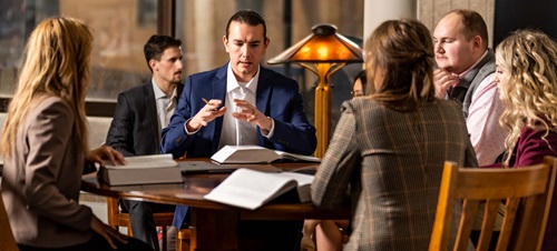 Law Students Sitting Around a Table Talking