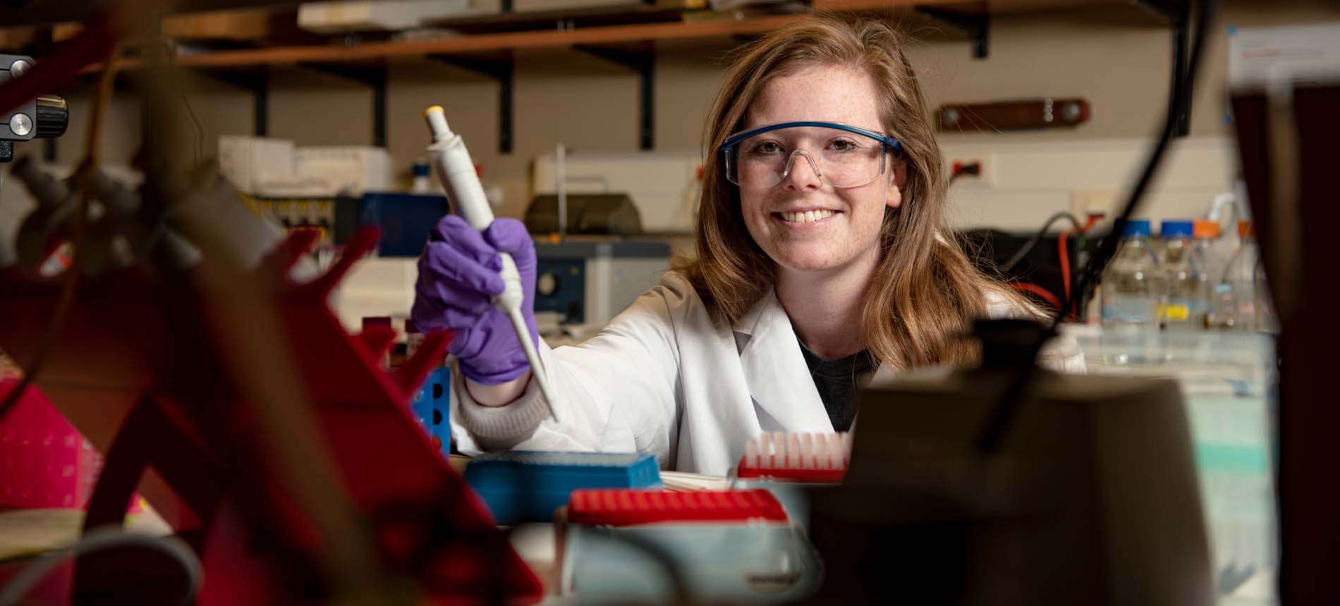 A biomedical sciences student doing lab work.