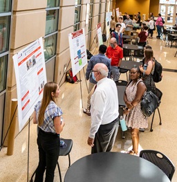 Students Presenting at a Research Symposium