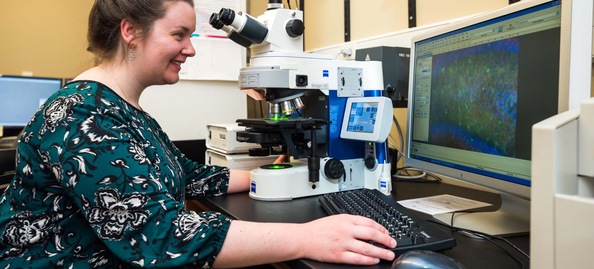 Female Researcher Using Equipment in Imaging Core Facility.