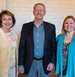 Dean Ridgway and company smiling into the camera.