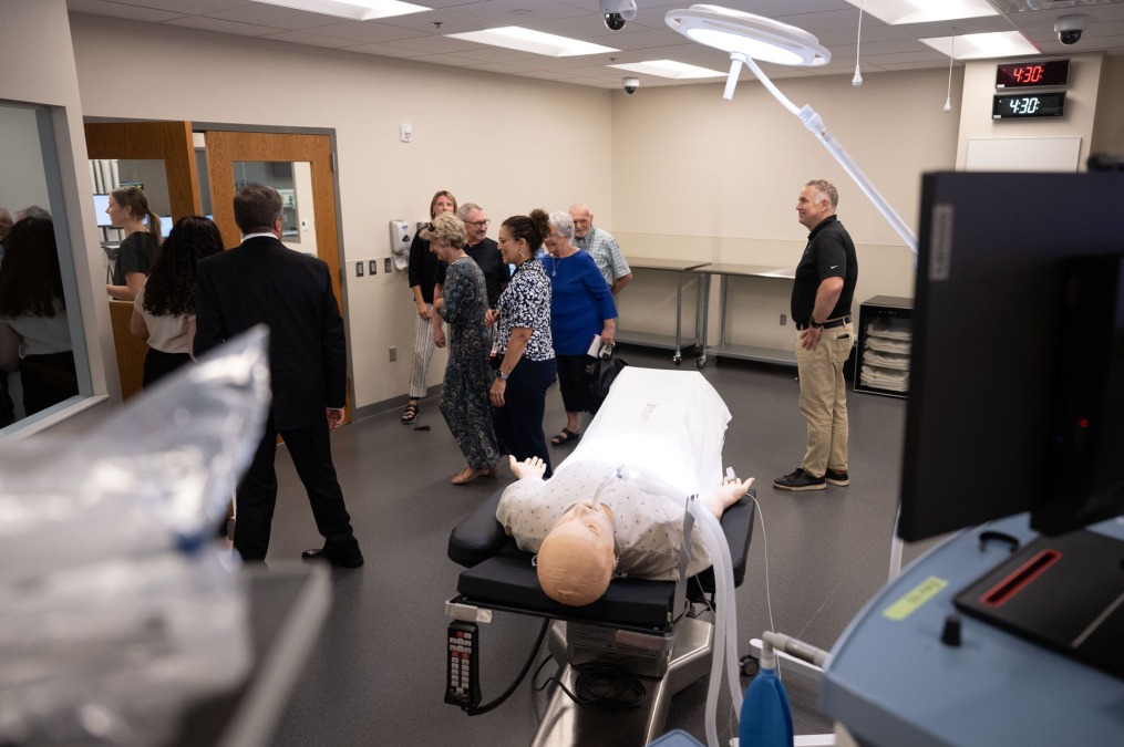 Visitors touring the Parry Center lab facilities and dummy medical testing.