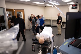 Visitors touring the Parry Center lab facilities and dummy medical testing.