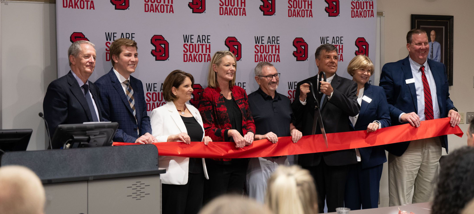 The USD Medicine leadership team cutting the ribbon unveiling the new Parry Center facilities.