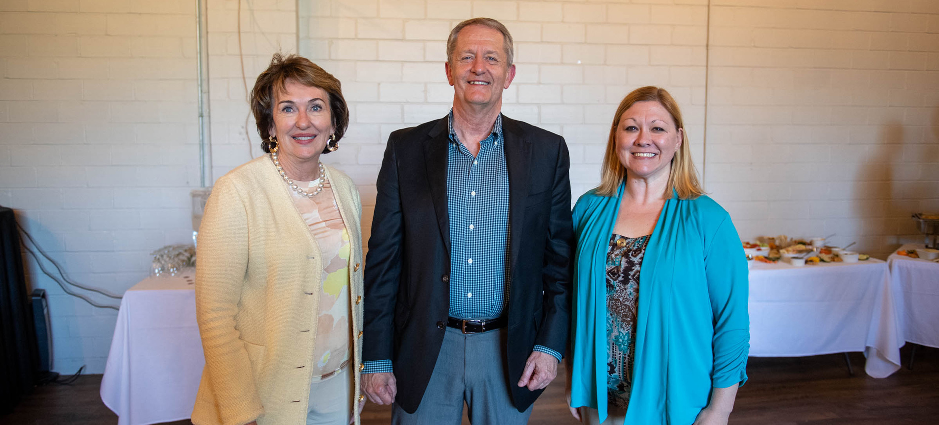 Three medical school faculty standing together.