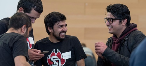 Students at a USD robotics competition.