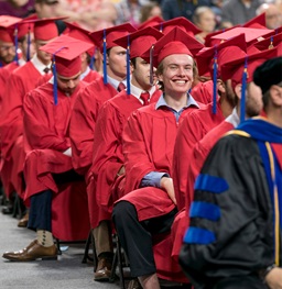 A Student Smiling at Graduation.
