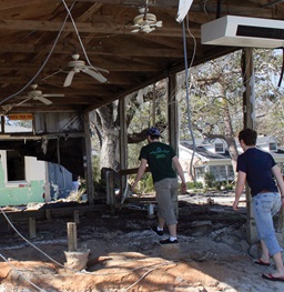 Workers cleaning up debris.