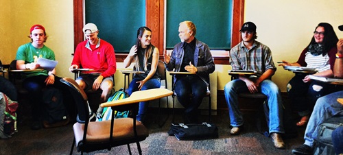 A group of Graduate students waiting for class to start.