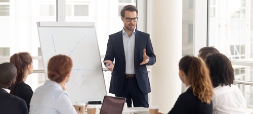 A man leading a business meeting.